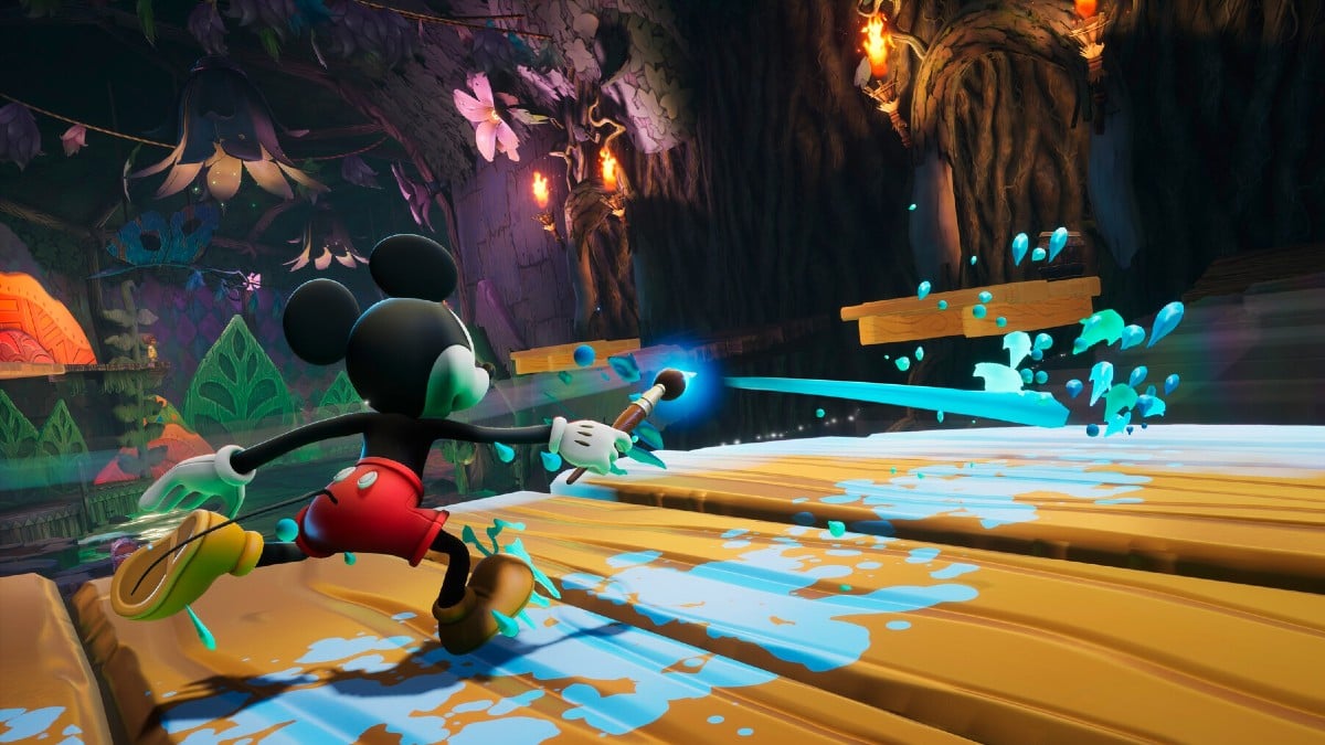 Mickey painting a structure in Epic Mickey: Rebrushed.