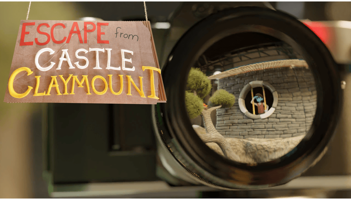 The opening still, from the main menu of Escape From Castle Claymount - showing the protagonist looking out from behinf bars, in a claymation style.